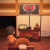 Personaggio di Animal Crossing New Horizons mentre la TV trasmette un messaggio alieno alle 3:33 del mattino.