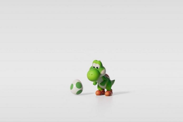 Primo piano di Yoshi dal nuovo trailer di The Super Mario Galaxy Movie, con un'espressione sorpresa e divertente.