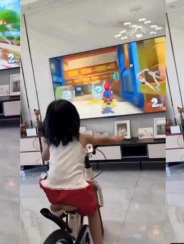 Video virale su X di una bambina che pedala su una bicicletta trasformata in cyclette mentre gioca a Mario Kart World su Nintendo Switch 2 con i comandi di movimento del Joy-Co